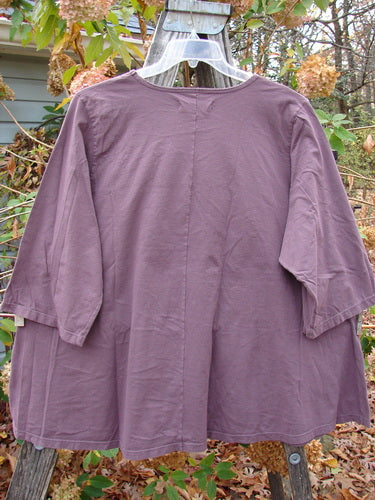 Barclay Three Quarter Sleeved Cafe Top Parrot Burgundy Size 2 displayed on a rack, highlighting its medium weight fabric and unique vintage style, reflective of BlueFishFinder's creative clothing collection.