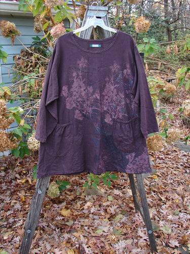 Barclay Woven Figure 8 Pocket Tunic Dress Bouquet Deep Wine Size 2 displayed on a wooden rack, featuring a floral design. Part of Bluefishfinder.com's vintage-inspired collection, offering creative expression through unique, timeless fashion.