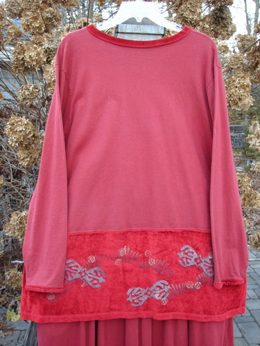 1996 Velvet Arrowhead Sofia Duo Pomegranate Size 1: A red shirt with a red design and trim, paired with a matching skirt. The shirt features a V neckline, cuffs, drop waistline, and dropped shoulders. The skirt has a bell-shaped upper, accent hem, and rear kick vent. Perfect for holiday or everyday wear.