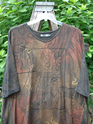 Barclay Tournesol Tunic Daisy Crane Metallic Bark OSFA displayed outdoors, featuring a tunic length, drop shoulders, and loose three-quarter sleeves with a unique varying hemline, exemplifying Bluefishfinder's vintage style.