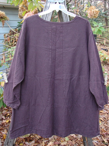 Barclay Woven Figure 8 Pocket Tunic Dress Bouquet Deep Wine, Size 2, displayed on a clothes rack. Features a heavy weight, long-sleeved design with a unique pattern, emphasizing individuality and vintage style.