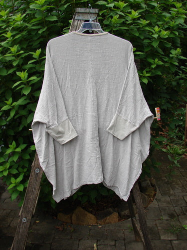 Barclay Gauze Open Front Cardigan Unpainted Natural Size 2 displayed on a hanger, featuring generous dolman sleeves, fully open front, and tall vented sides, embodying Bluefishfinder.com's vintage, creative style.