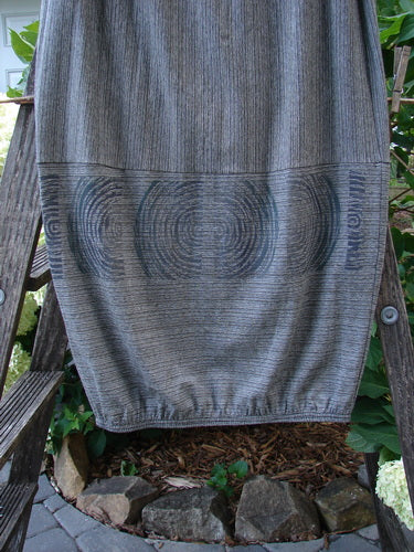 2000 Rayon Lycra Promenade Skirt Celtic Stripe Cliffshadow Size 0 displayed on a wooden ladder, showcasing its full elastic waistband, horizontal accent seams, and elastic gathered hem.