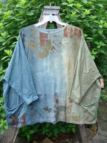 Barclay Cotton Lycra Writer's Pocket Sweatshirt features a seamless front and back with dynamic metallic botanical art, dual drop flop pockets, and a wide square flair design, showcasing BlueFishFinder's unique vintage style.