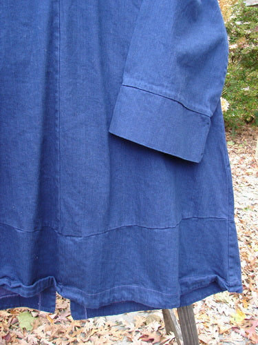 Close-up of Barclay Denim Triangular Collar Coat, featuring intricate triangular lines and panels, in perfect condition.