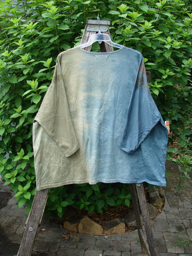 Barclay Cotton Lycra Writer's Pocket Sweatshirt displayed on a wooden stand, showcasing its seamless front, dynamic metallic botanical art, and dual drop flop pockets, embodying BlueFishFinder.com's vintage-inspired creative style.