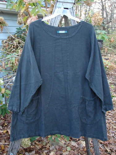 Barclay Woven Summercloth Figure 8 Pocket Tunic Dress Unpainted Forest Size 2 displayed on a clothes rack, featuring a heavy weight, long-sleeved design, ideal for expressing individuality through vintage Blue Fish Clothing.