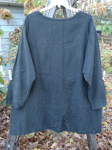 Barclay Woven Summercloth Figure 8 Pocket Tunic Dress Unpainted Forest Size 2 displayed on a clothes rack, showcasing its heavy weight long sleeves and unique design, reflecting Bluefishfinder.com's vintage style.