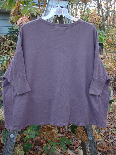 Barclay Hemp Cotton Banded Sleeve Dolman Top Butterfly Maroon OSFA displayed on a wooden rack, highlighting its unique sleeve design and casual elegance, reflecting Bluefishfinder.com's dedication to vintage, expressive fashion.