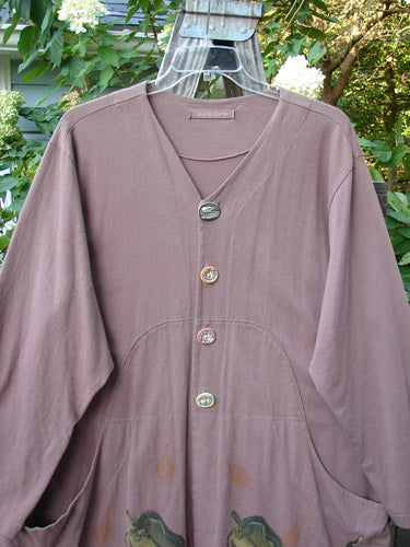 1998 Harvest Jacket Veggie Garden Eggplant Size 2 displayed on a hanger, showcasing long sleeves, two front oversized pockets, and unique artisan porcelain buttons with a slightly deeper V neckline.