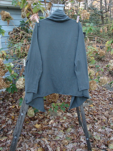 Barclay Cotton Lycra Gather Collar Open Front Jacket Unpainted Forest Size 2 displayed outdoors on clothespins, showcasing its medium weight and pocketed design, embodying the vintage style of BlueFishFinder.com.