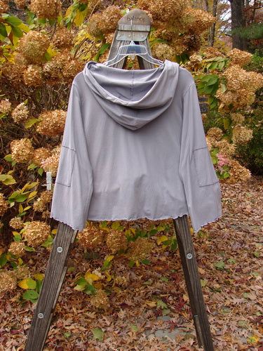 Barclay Patched Cotton Lycra Hooded Shrug Jacket, lilac, size 2, on wooden stand.