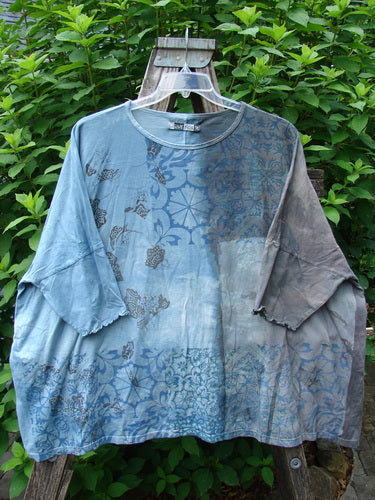 Barclay Dolman Curl Edge Square Pullover Victorian Mandela Mottled Sky Gray OSFA showcased outdoors, highlighting its seamless, boxy shape and unique curly arm edgings, embodying Bluefishfinder.com's vintage style.