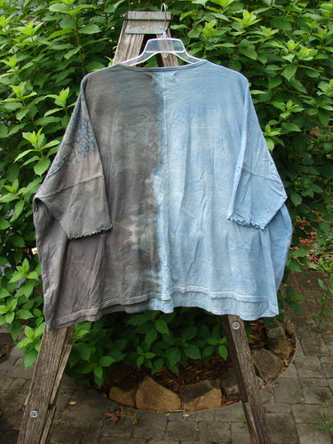 Barclay Dolman Curl Edge Square Pullover Victorian Mandela Mottled Sky Gray OSFA displayed on a wooden rack, showcasing a seamless, boxy shape with drop shoulders and curly arm edgings.