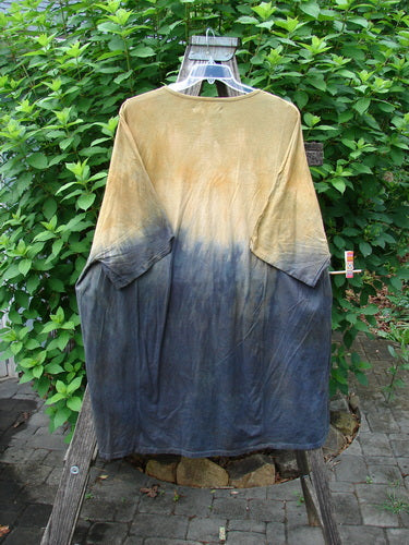 Barclay NWT Art Tee Unpainted Sun Field & Night OSFA displayed on a hanger, showcasing its longer tunic length, drop shoulders, rounded neckline, and loose three-quarter sleeves, reflecting Bluefishfinder.com’s unique vintage style.