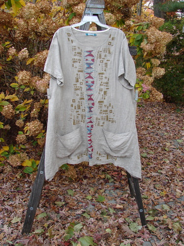 Barclay Linen Figure 8 Drop Pocket Tunic Dress with hourglass theme details.
