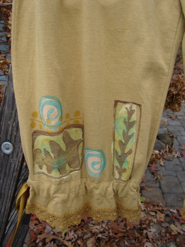 1992 Pantaloon Sea Turtle Camino OSFA: A close-up of a skirt with a sea turtle theme paint and antique lace details.