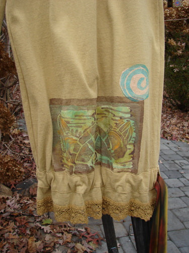 1992 Pantaloon Sea Turtle Camino OSFA: A close-up of a skirt with antique lace and a sea turtle theme paint.