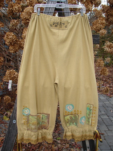 1992 Pantaloon Sea Turtle Camino OSFA: A pair of pants with a painted sea turtle design and antique lace accents.