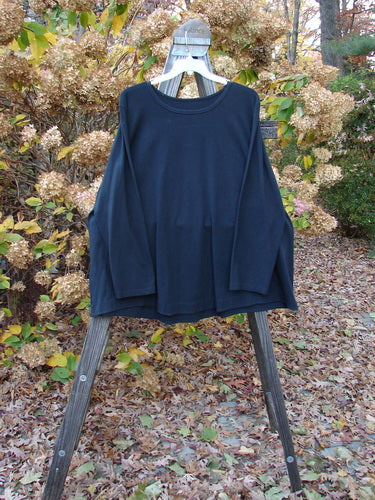Barclay cotton lycra long sleeved swing top on a rack.