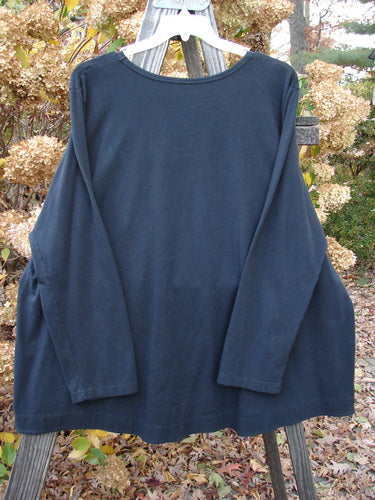 Barclay Cotton Lycra Twinkle Top on rack, A-line shape, rounded hem, billowy flare, size 3.