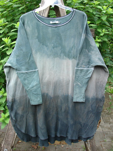 Barclay Thermal Contrast Revival Top Unpainted Mottled Sage Shade OSFA, featuring ribbed sleeves and neckline, showcased on a swinger, highlighting its unique A-line shape and easy side vents.