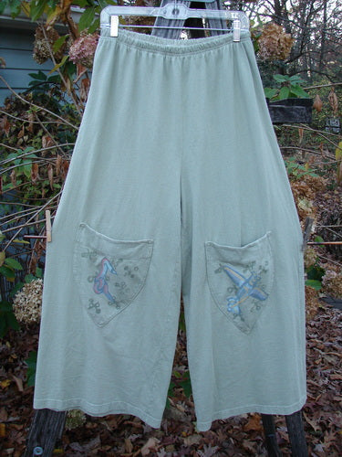 2001 Wishpocket Pant Airplane Kelp Size 1, featuring wide leg design, elastic waist, and unique painted airplane-themed knee pockets, showcasing vintage Blue Fish Clothing's creative style.