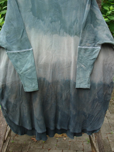 Barclay Thermal Contrast Revival Top in Mottled Sage Shade showcased outdoors, highlighting its ribbed sleeves, rounded neckline, and A-line shape, epitomizing BlueFishFinder's vintage and expressive style.