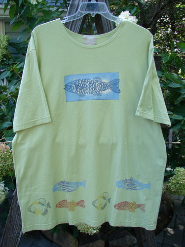 2000 Short Sleeved Tee Fish School Key Lime Pie Size 2, featuring a fish design, wide sleeves, drop shoulders, and a generous shape. Vintage Blue Fish Clothing from the Spring 2000 Collection.