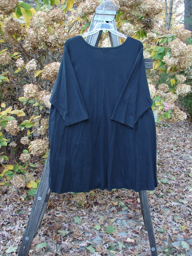 Barclay Hi Low Pocket Tunic Top on rack, with double lower front pockets, three-quarter sleeves. Size 2 ai, black.