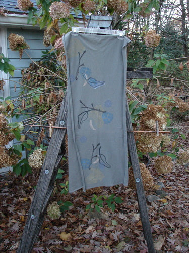 1994 Scarf Forest Leaf Raku One Size draped over a ladder, showcasing its intricate branch pattern. This vintage Blue Fish Clothing piece embodies creative expression, aligning with Bluefishfinder.com's unique, timeless style ethos.