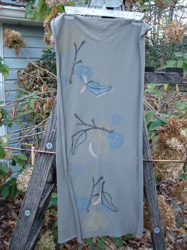 A grey dress featuring a painted design, part of the 1994 Scarf Forest Leaf Raku collection, embodies vintage Blue Fish Clothing's artistic flair and creative expression.