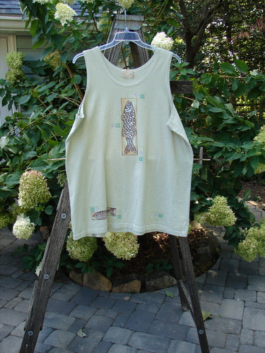 2000 Summer Tank Top Fish Dune Grass Size 2, displayed on a wooden rack, featuring deeper arm openings, a straighter longer shape, and a fun fish theme paint with a signature blue fish patch.