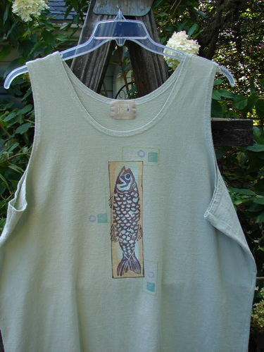 2000 Summer Tank Top Fish Dune Grass Size 2 displayed on a hanger, featuring deeper arm openings and a fun fish theme paint. Mid-weight organic cotton with a straighter, longer shape.