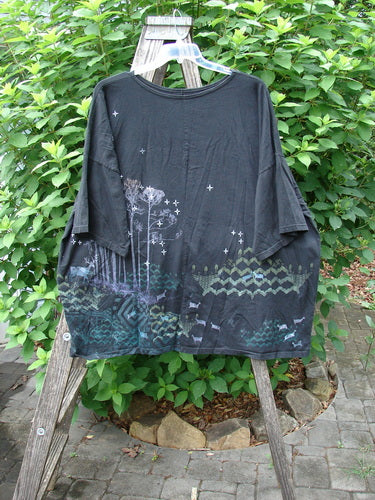 Barclay Center Seam Wide Line Tee Tree Moon Star Black OSFA displayed on a hanger, showcasing its wide, boxy shape, significant drop shoulders, and unique tree and moon star design.