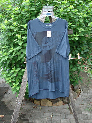 Barclay NWT Tournesol Slim Tunic Turn Moon Navy OSFA displayed on a wooden rack, highlighting its loose three-quarter sleeves, drop shoulders, and varying hemline, reflecting BlueFishFinder's vintage, creative clothing style.