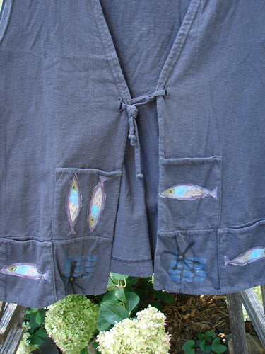 1999 Fishing Vest Fish School Orbit Size 2, featuring double paneled front squared pockets, a tie front, deeper arm openings, and a special rear pocket, adorned with fish school theme paint.