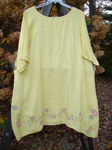 Barclay Linen Vertical Seam Lace Bottom Dress Swirl Sunshine Size 2 on clothesline.
