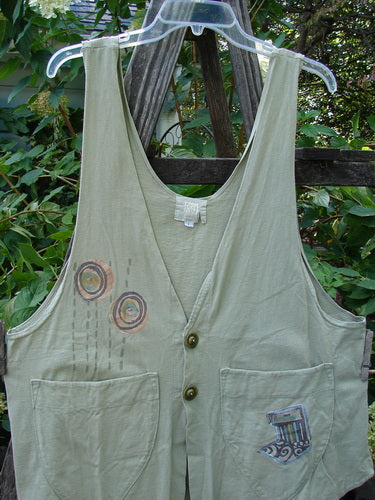 2001 Katy Vest Circle Rain Kelp Size 1 displayed on a mannequin, showcasing thin shoulder straps, two front pockets, and textured button closures with a unique A-line, swingy hem.