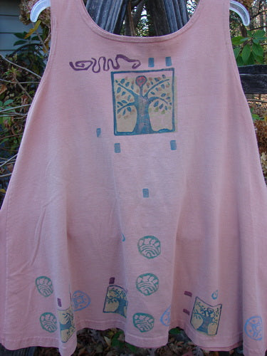 1991 Tab Dress Heart Tree Salmon Altered OSFA, a pink dress featuring a hand-painted tree design, embodies the vintage, expressive style of Blue Fish Clothing.