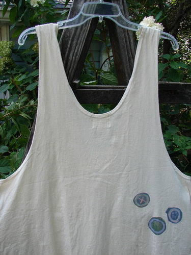 2001 Katy Vest Chain Rain Natural Size 1 displayed on a hanger, showcasing thin shoulder straps, a swingy lower section, and two front triangular pockets with button closures.