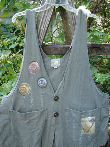 2001 Katy Vest Shell Rain Inkpod Size 1 displayed on a wooden fence, featuring thin shoulder straps, a-line shape, two front triangular pockets, and blue fish button closures.