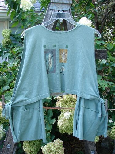 1994 Pocket Vest Magic Dance Kelp OSFA, featuring a blue design with a drop front, two bottom pockets with vintage buttons, adjustable tie sides, and a cropped back.