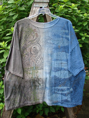 Barclay Wide Line Tee Wind Fish Mottled Navy Gray OSFA displayed on a rack, featuring a seamless design with wide, boxy shape and significant drop shoulders, exemplifying Blue Fish Clothing's vintage, artistic style.