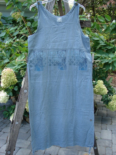 2000 Almost 7 Jumper Rock Wall Blue Mineral Size 1 displayed on a wooden ladder, featuring button shoulders, a rounded neckline, yoke seams, and unique tabbed sides at the hem.