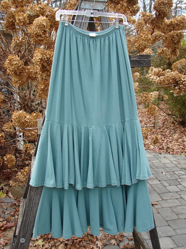 1993 Two Story Skirt on clothes rack with ruffles, made from teal cotton jersey. Size 2.