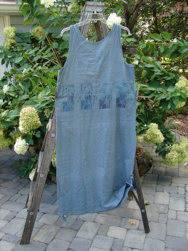 2000 Almost 7 Jumper Rock Wall Blue Mineral Size 1 displayed on a wooden ladder, showcasing button shoulders, a deeper neckline, yoke seams, tabbed sides, and a tapering hemline.