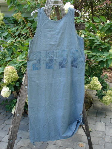 2000 Almost 7 Jumper Rock Wall Blue Mineral Size 1 displayed on a wooden ladder with its unique tabbed sides, sweet button shoulders, and slightly tapering hemline visible.