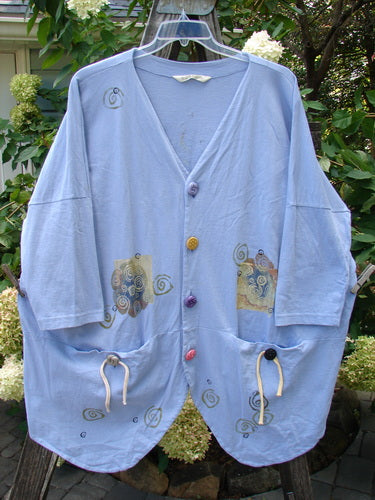 1997 Day Jacket Curl Wind Freesia OSFA featuring assorted vintage buttons, two front pockets, dolman sleeves, V neckline, drop shoulders, and a unique curl wind theme paint.