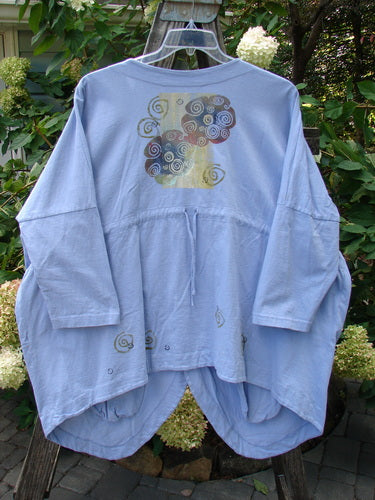 1997 Day Jacket Curl Wind Freesia OSFA: Organic cotton jacket with dolman sleeves, vintage buttons, front pockets, rounded tails, scooped back hem, and Curl Wind theme design detailing.